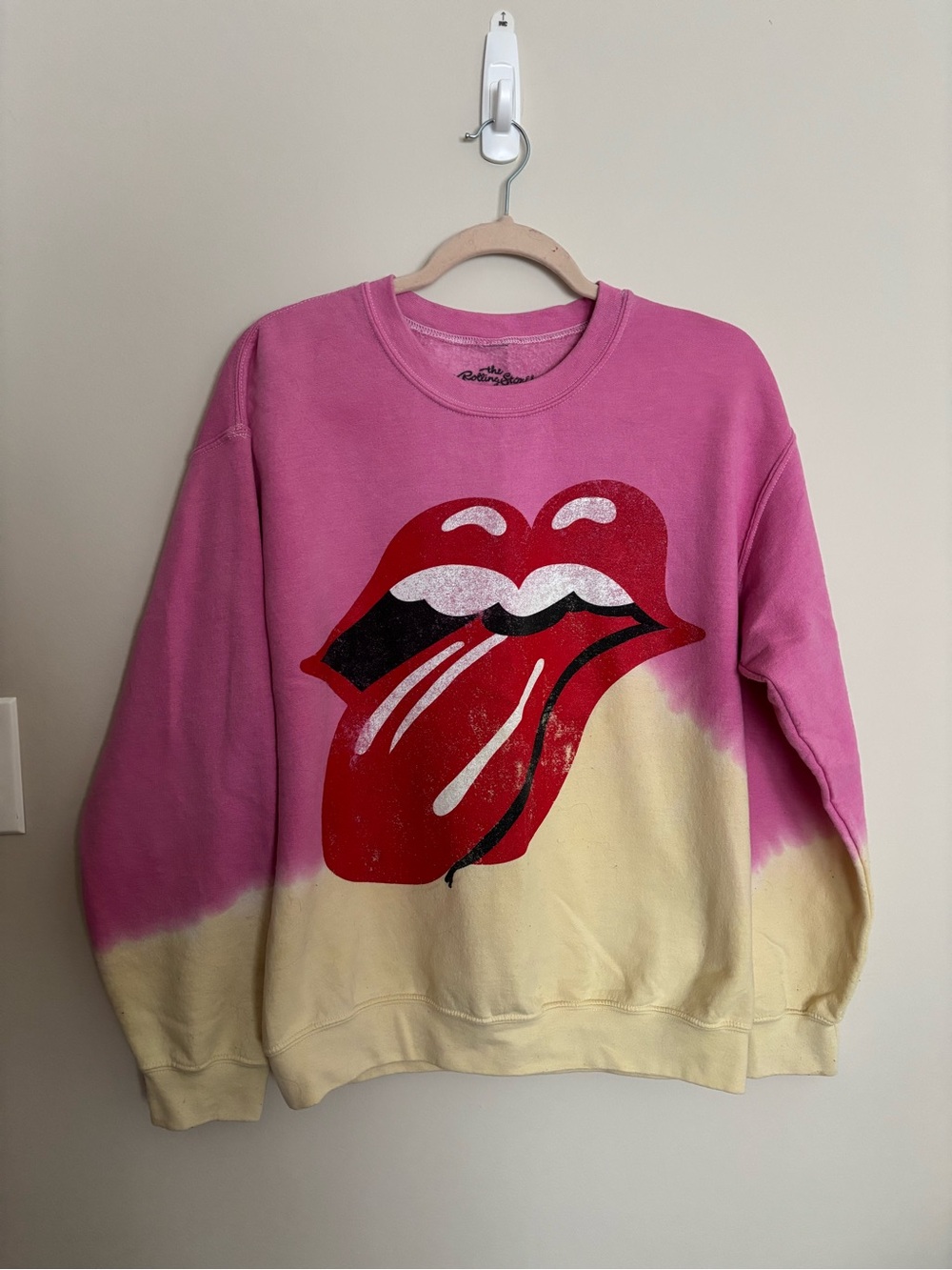 the Rolling Stones Pink and Yellow Crewneck Sweatshirt with Red Tongue Graphic